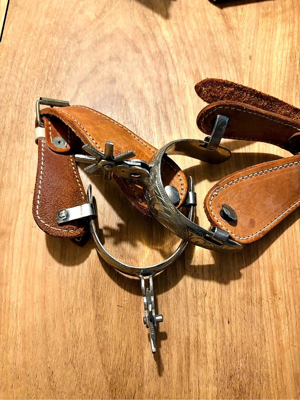 Engraved Authentic Western Spurs with Brown Leather Straps from the 70’s.